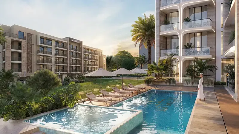 Pool deck with loungers beside the building