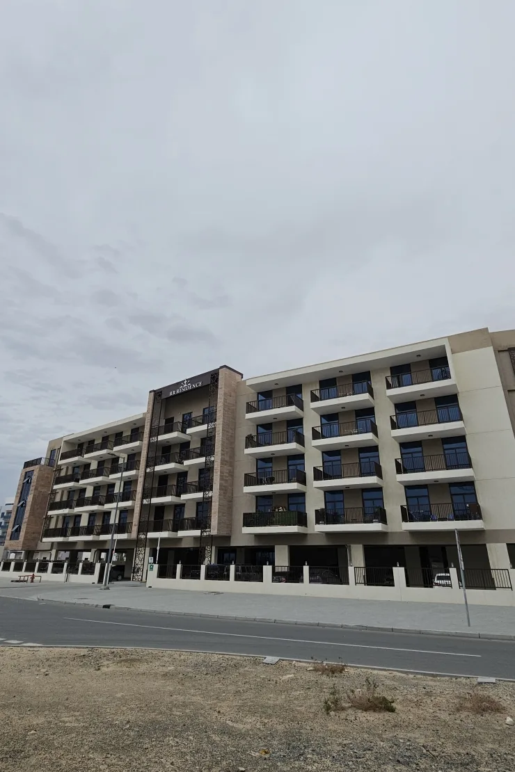 RR Residence full facade from street, signage visible