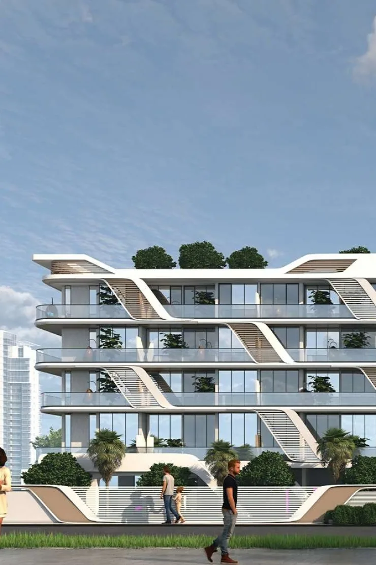 Street-level view of the stepped white facade