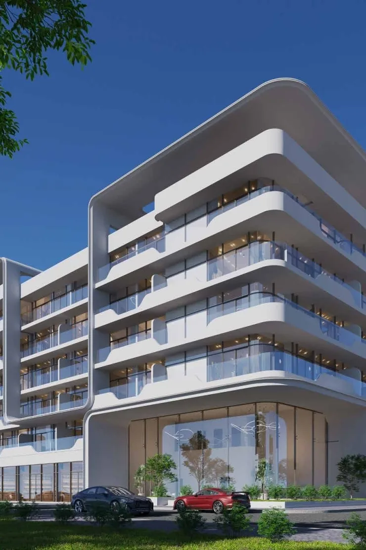 Corner of white building with curved glass balconies
