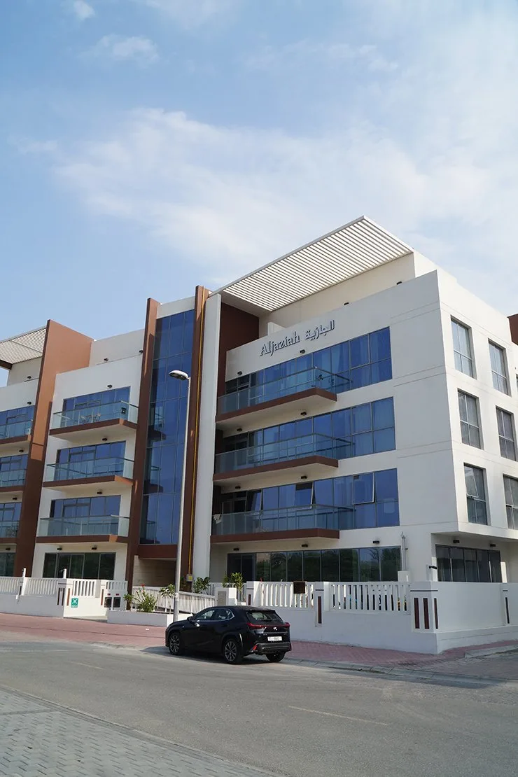 Front facade with Aljaziah signage, full height