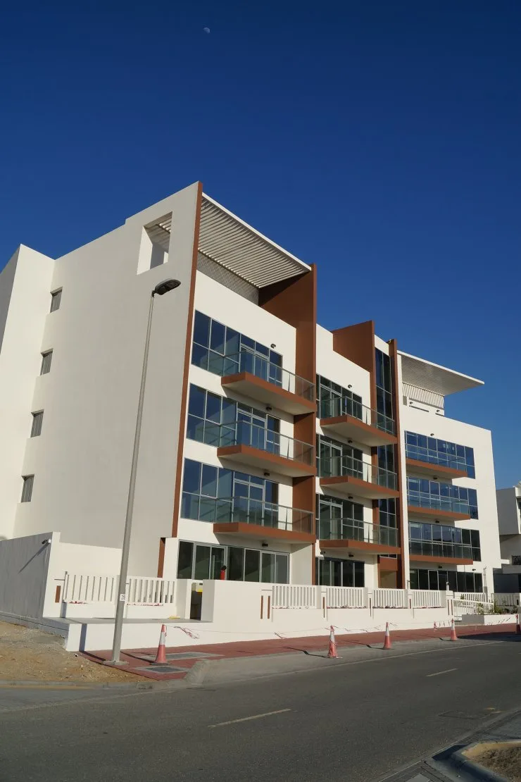 Side and front facade with glass balconies