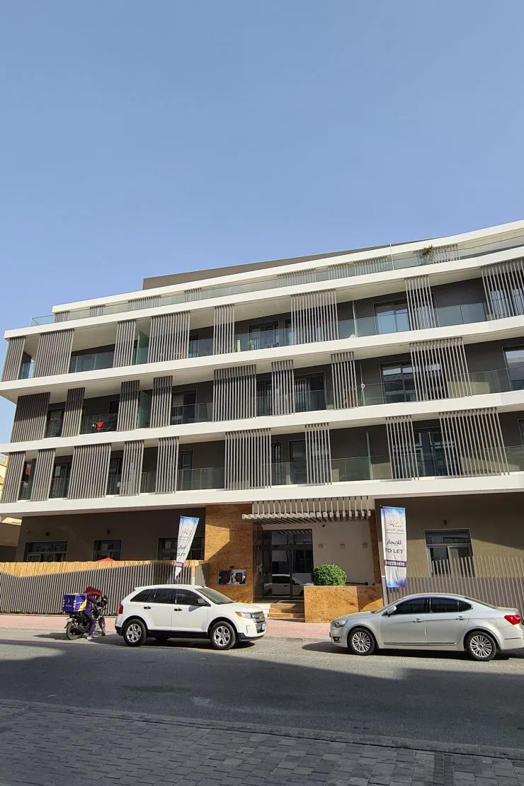 Front facade with entrance and vertical louvres