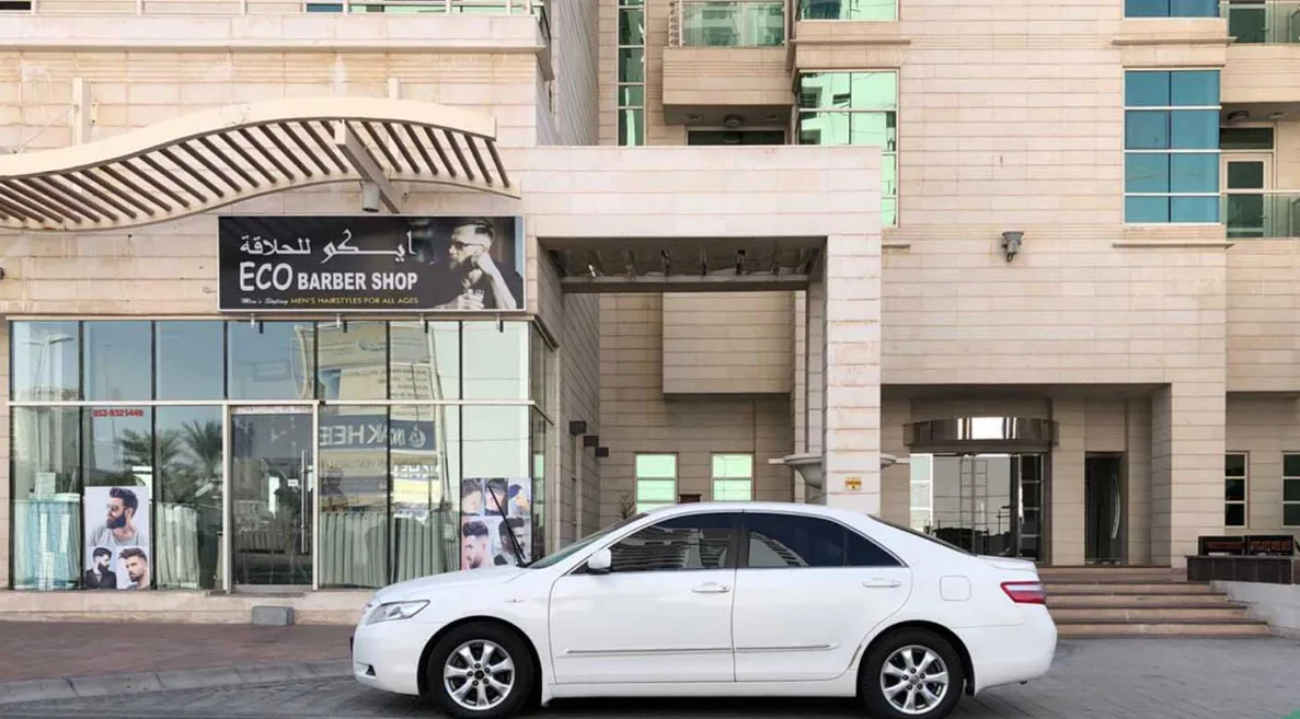 Ground-floor entrance and retail with matching stone cladding