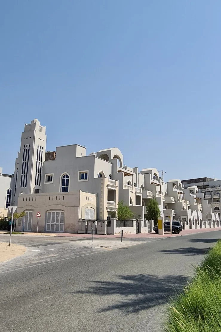 Townhouse cluster with corner tower and arches