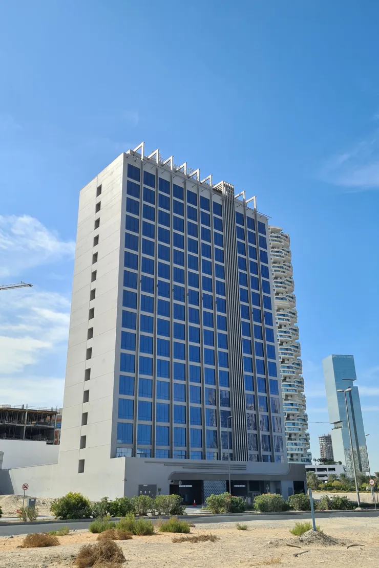 Corner view of tower under blue sky