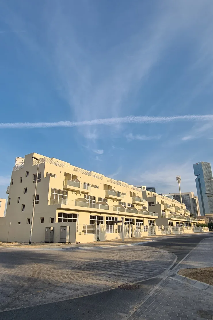 Completed cream building from corner, street side