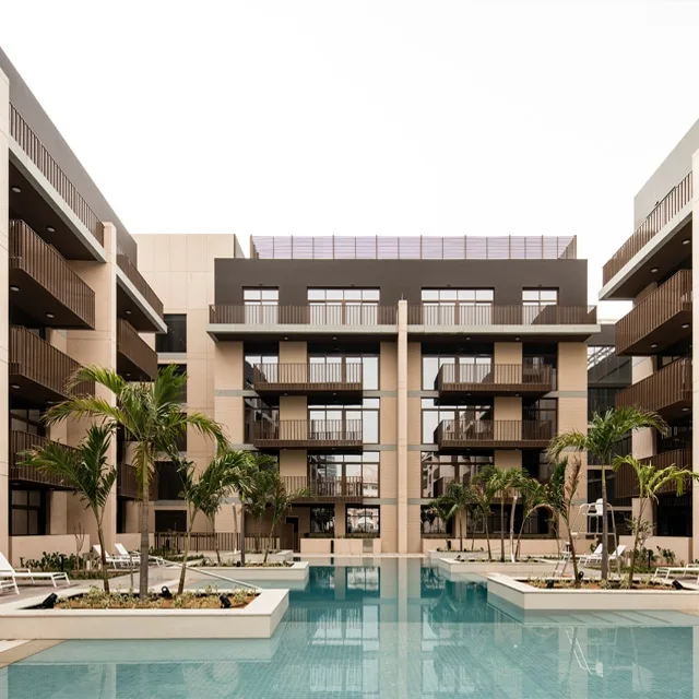 Courtyard pool with palms and balconied facade