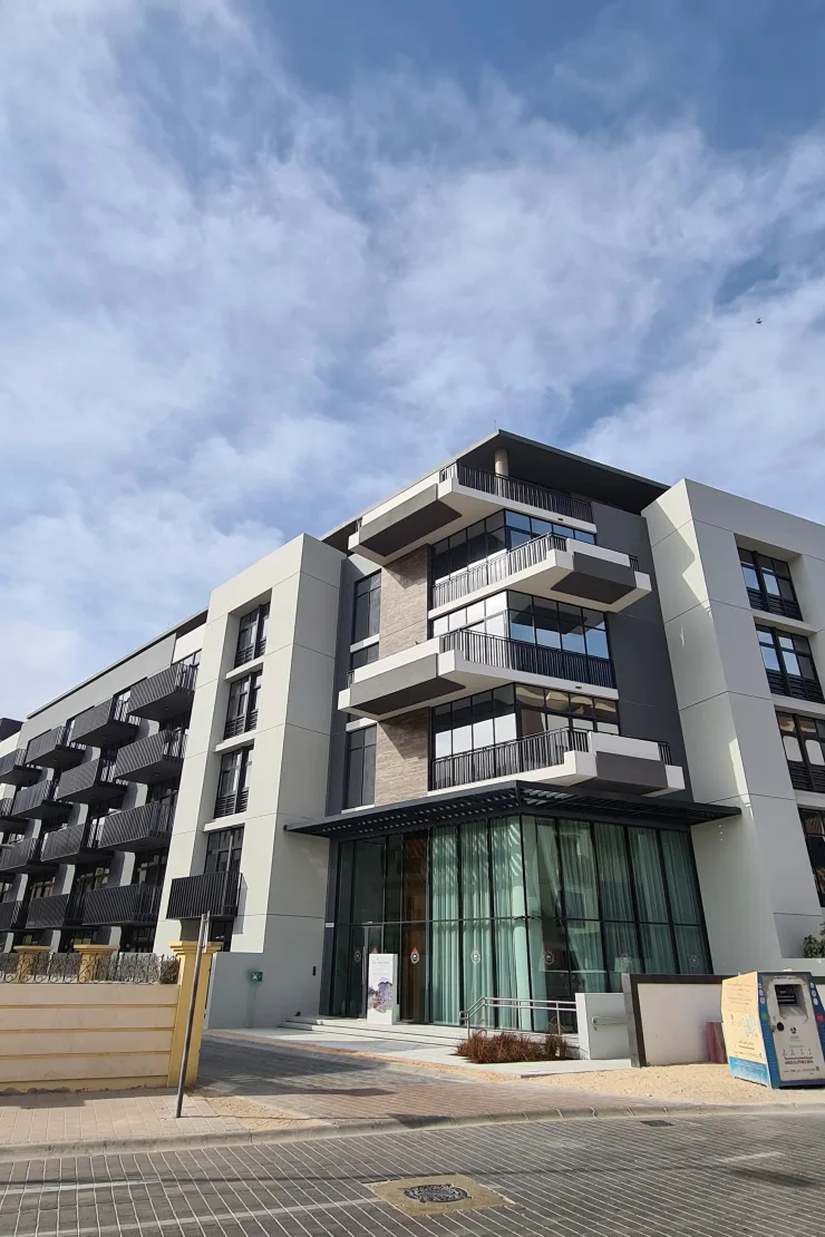 Entrance and stacked balconies of completed building