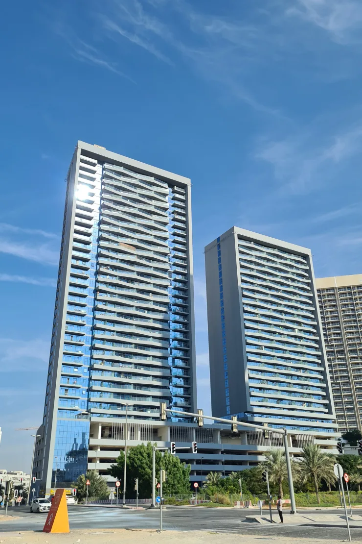 Both Bloom Heights towers from street, full height