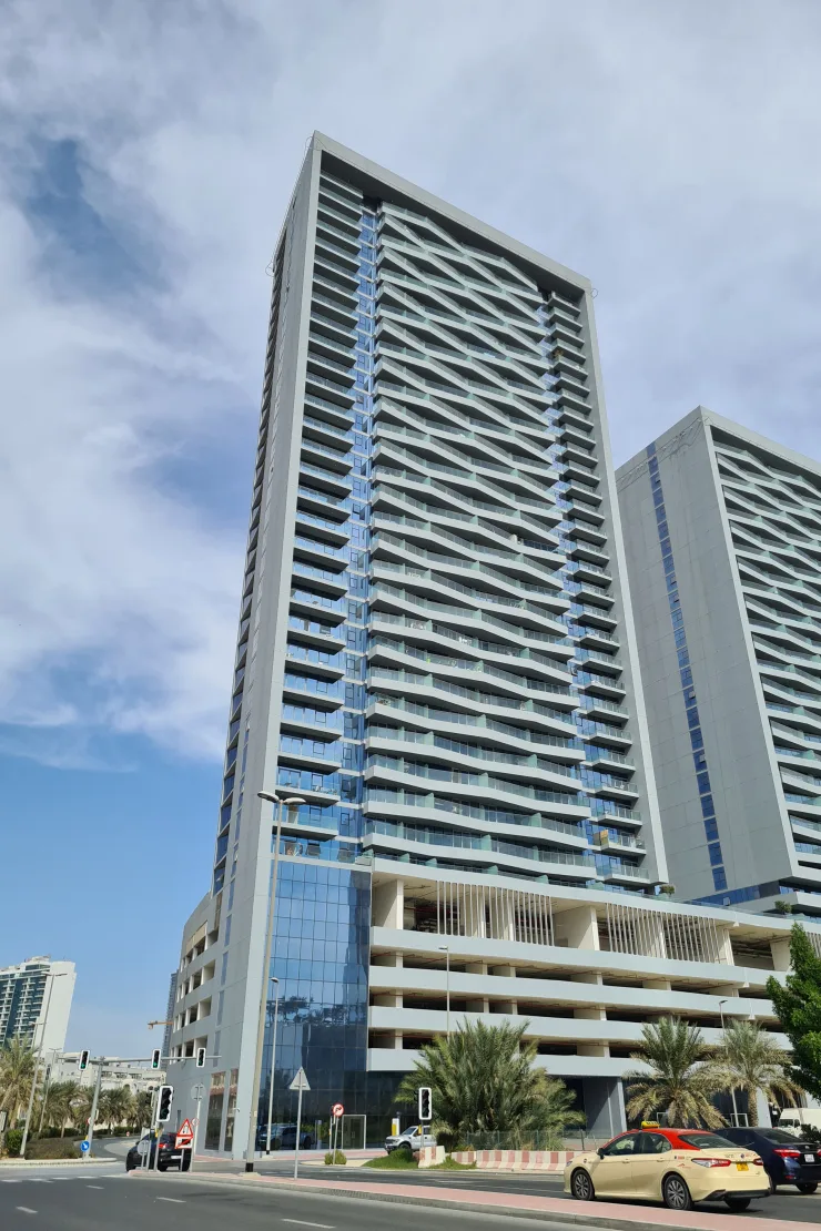 Bloom Heights tower with podium parking, street view
