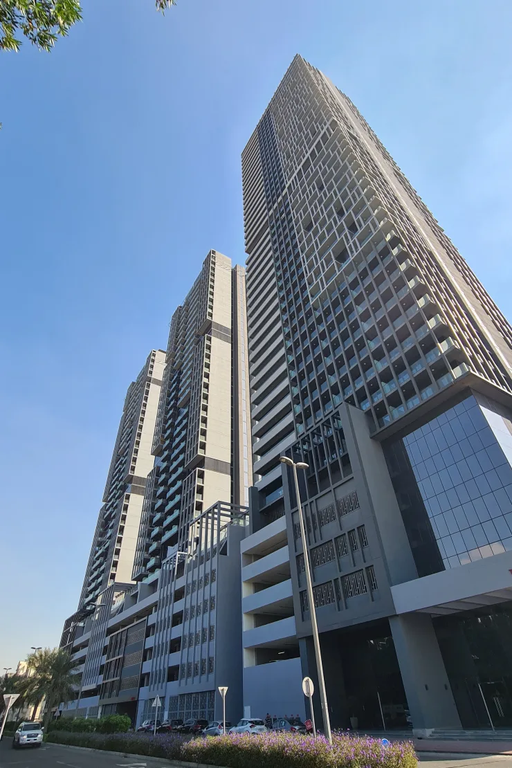 Low-angle view of tallest tower and podium entrance