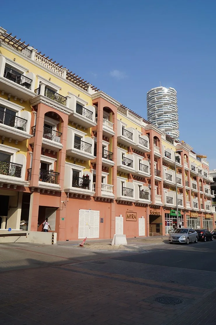 Long street facade with Myra signage