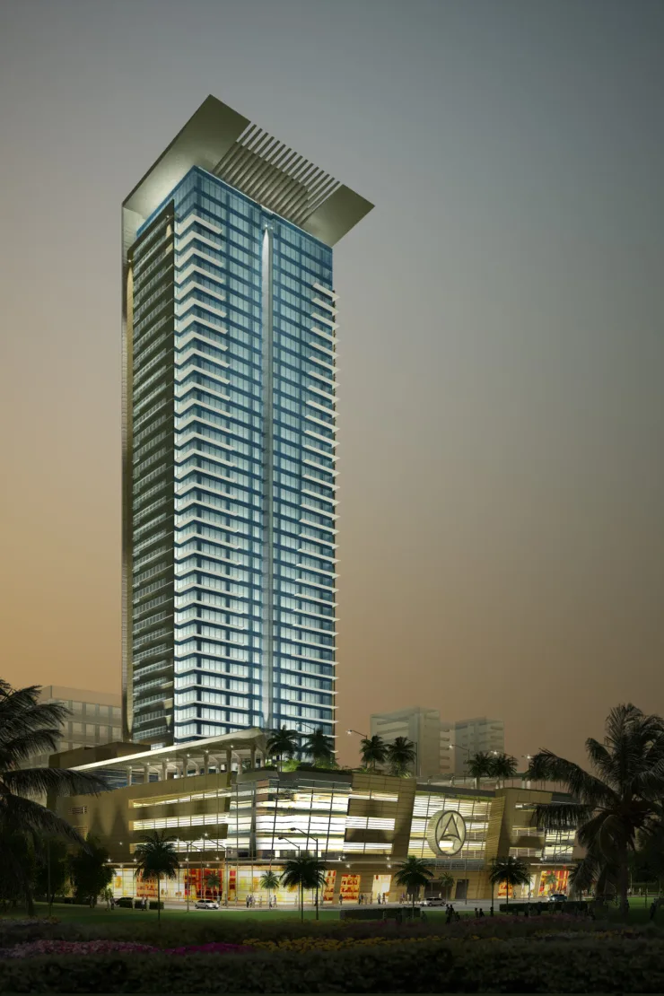 Tower with cantilevered crown above retail podium, dusk