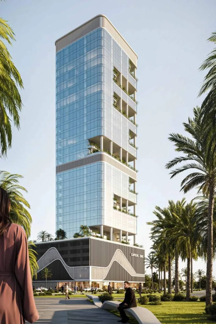 Full-height tower and wavy podium from park path