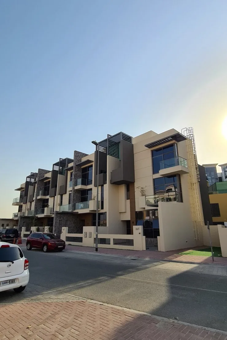 Row of modern townhouses with balconies, street view