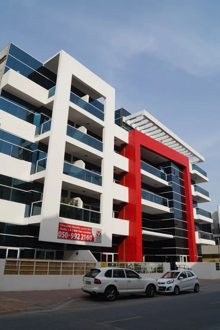 Street view showing white and red facade