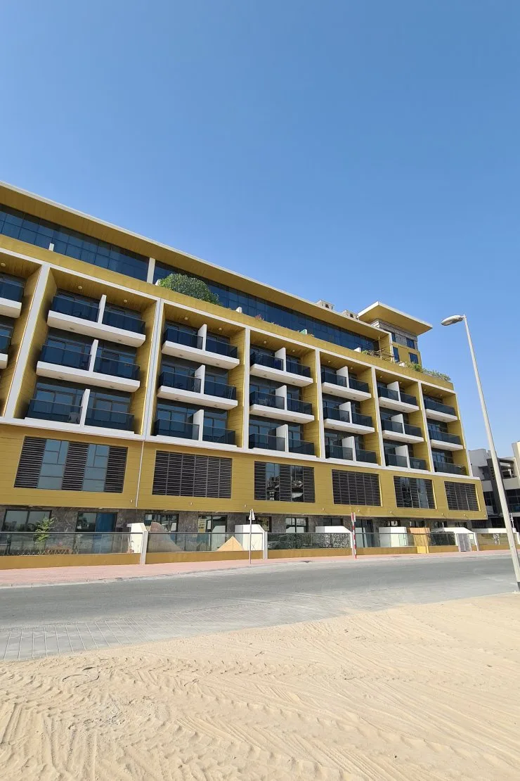 Street-side facade with gold cladding and balconies