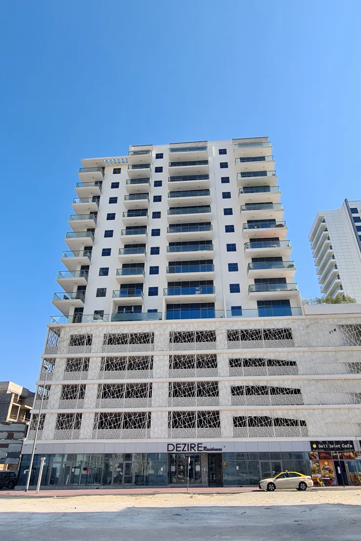 Completed tower with lattice podium and Dezire signage