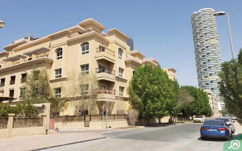 Corner of beige Mediterranean-style building from the street