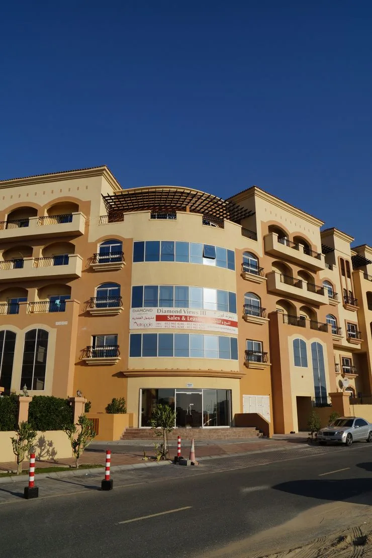 Front facade with curved glazed bays and entrance