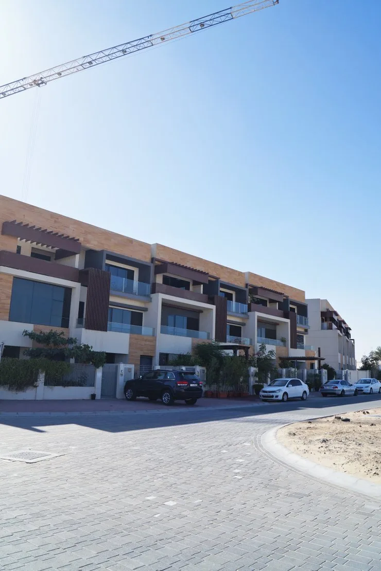 Three-storey townhouse block with timber and stone cladding