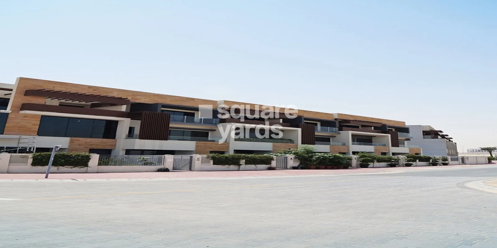 Street view of Divine Homes facade and landscaping