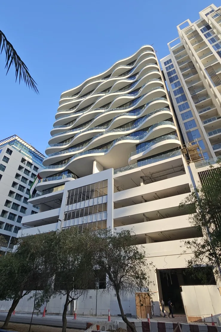 Curving white balconies, low-angle view with podium