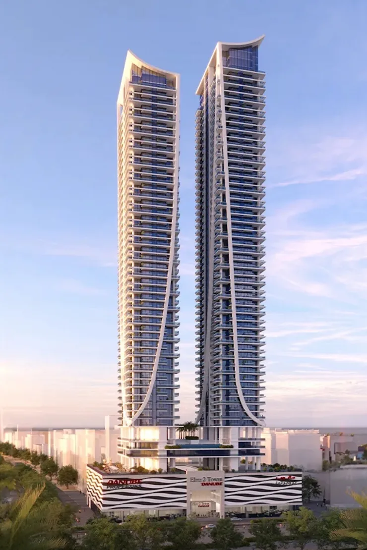 Twin towers with curved white ribs and Danube podium