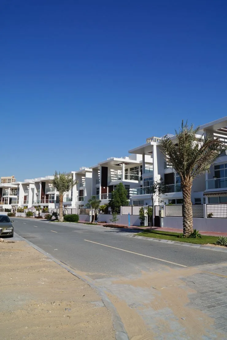 Row of white villas along street