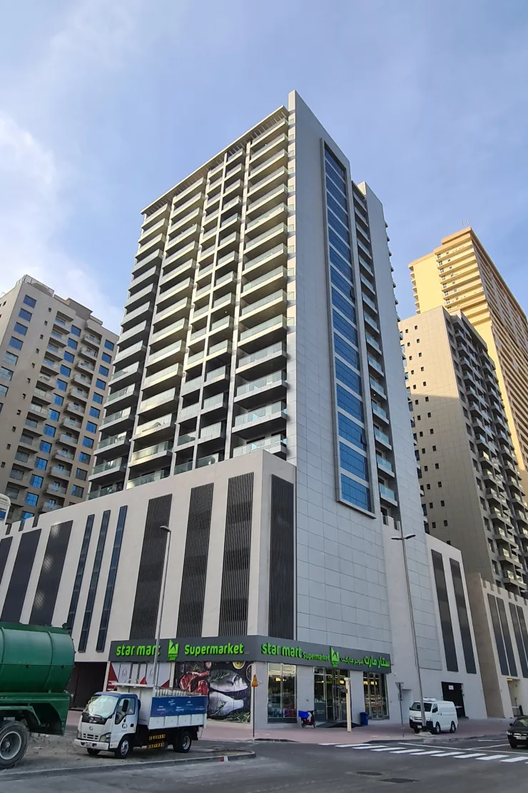 Completed tower with blue glazing strip and podium