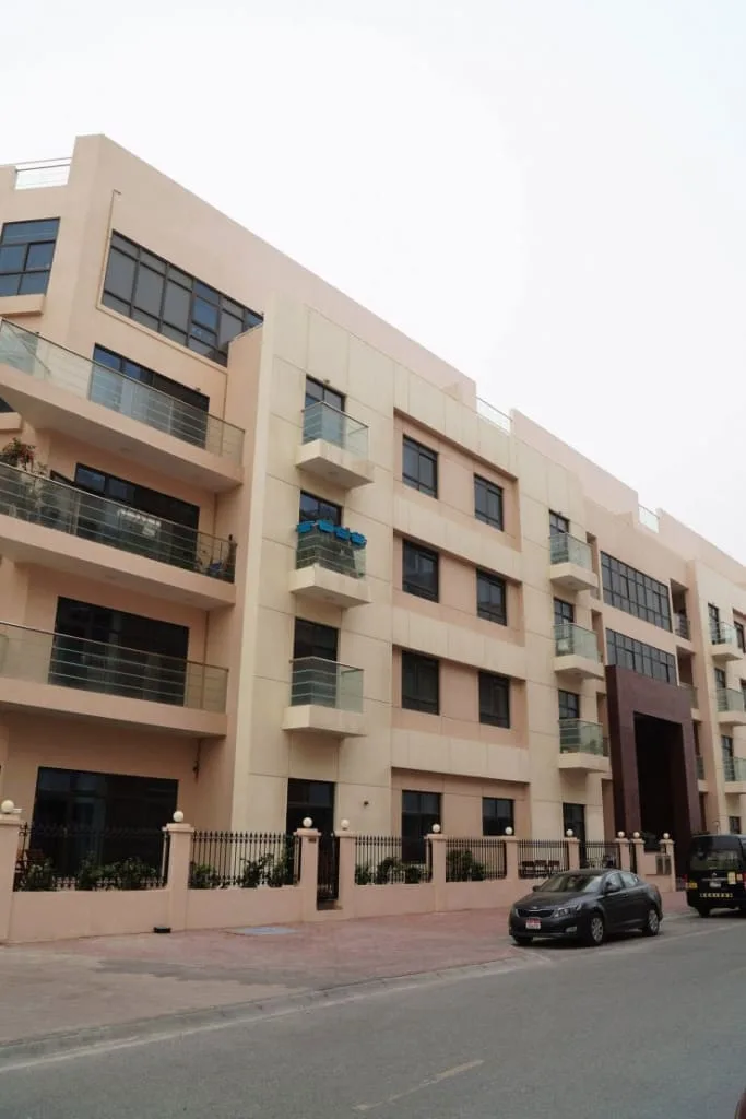 Street-side facade with balconies and brown entrance