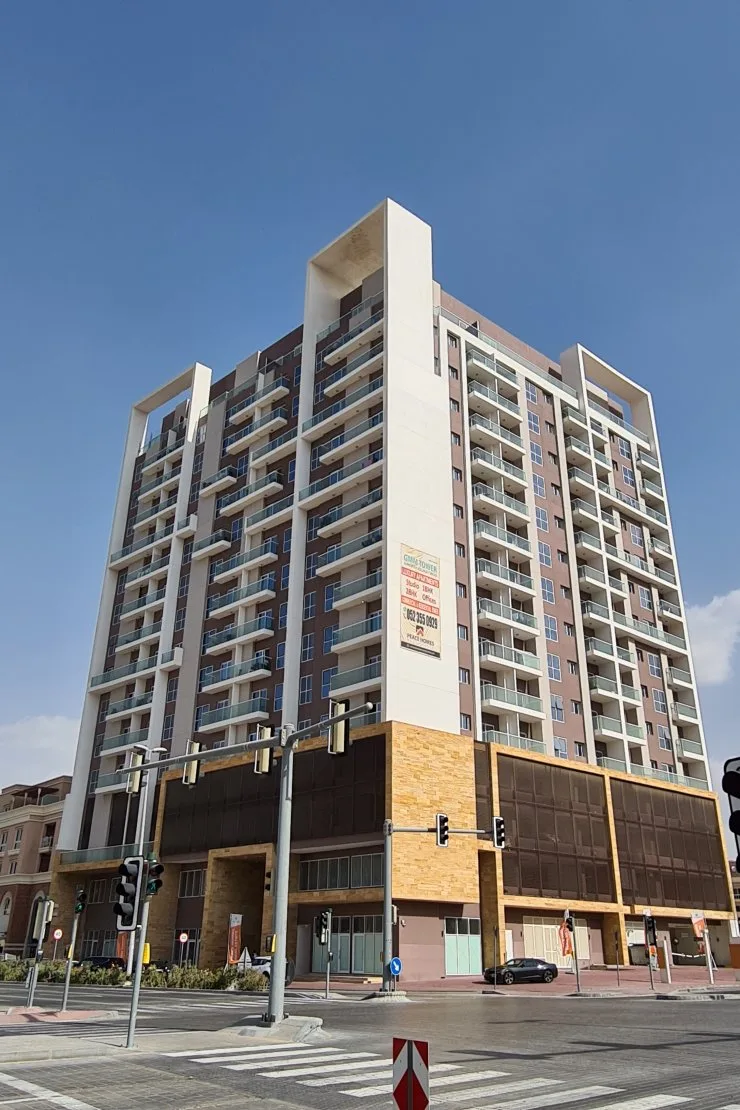 Full-height corner view of completed tower