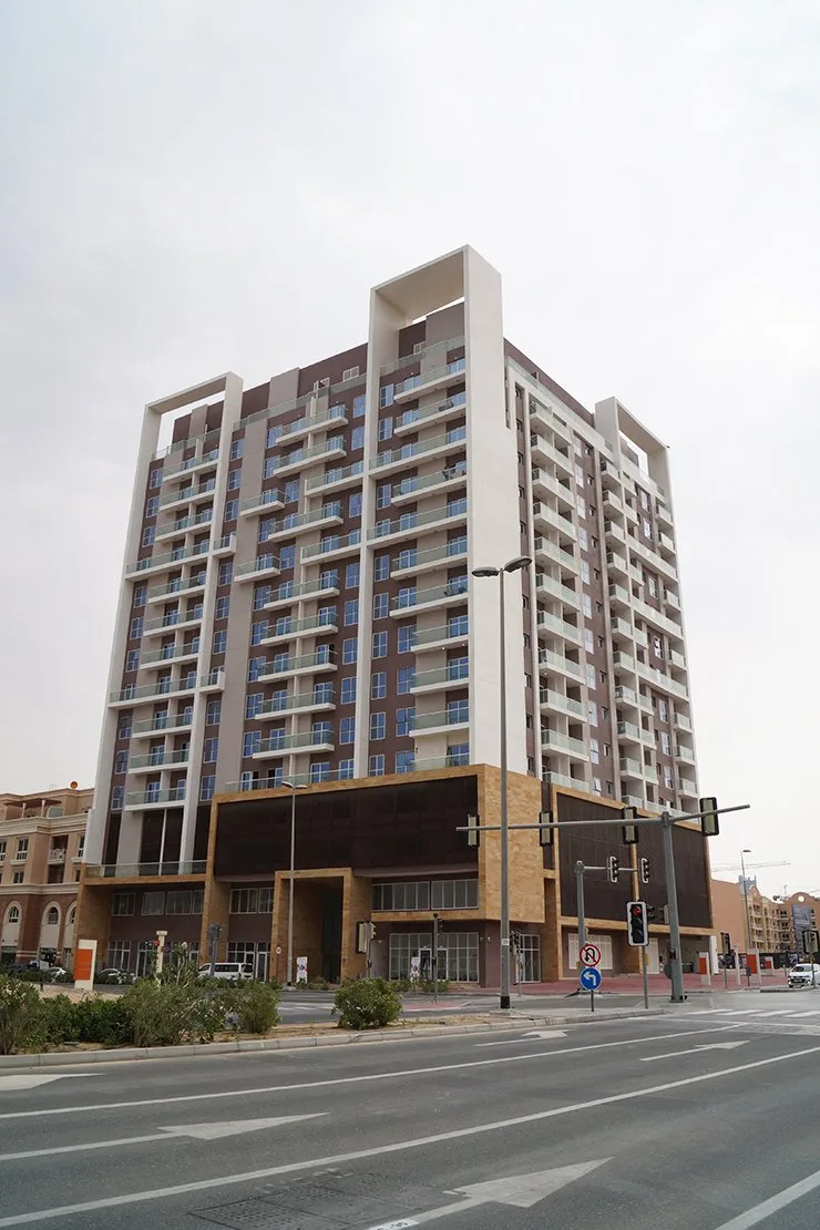 Full tower from street, podium to roof