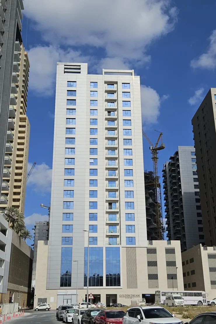 Completed tower facade with Golden Dream Tower signage
