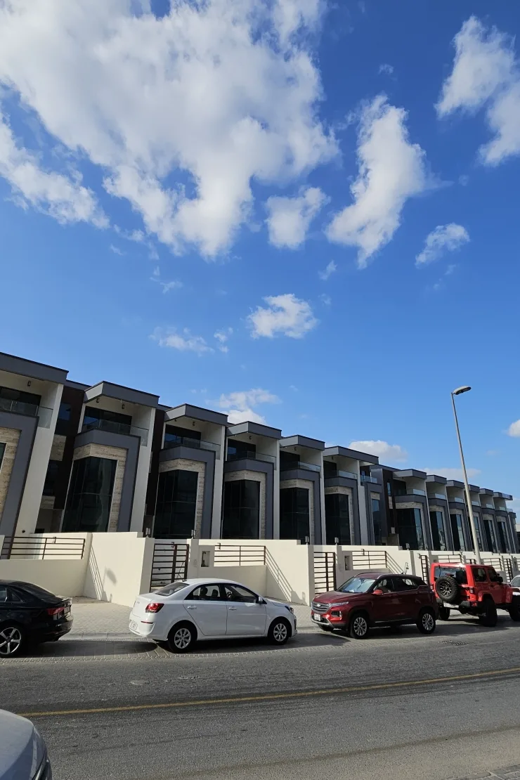 Townhouse row street view with glazed facades