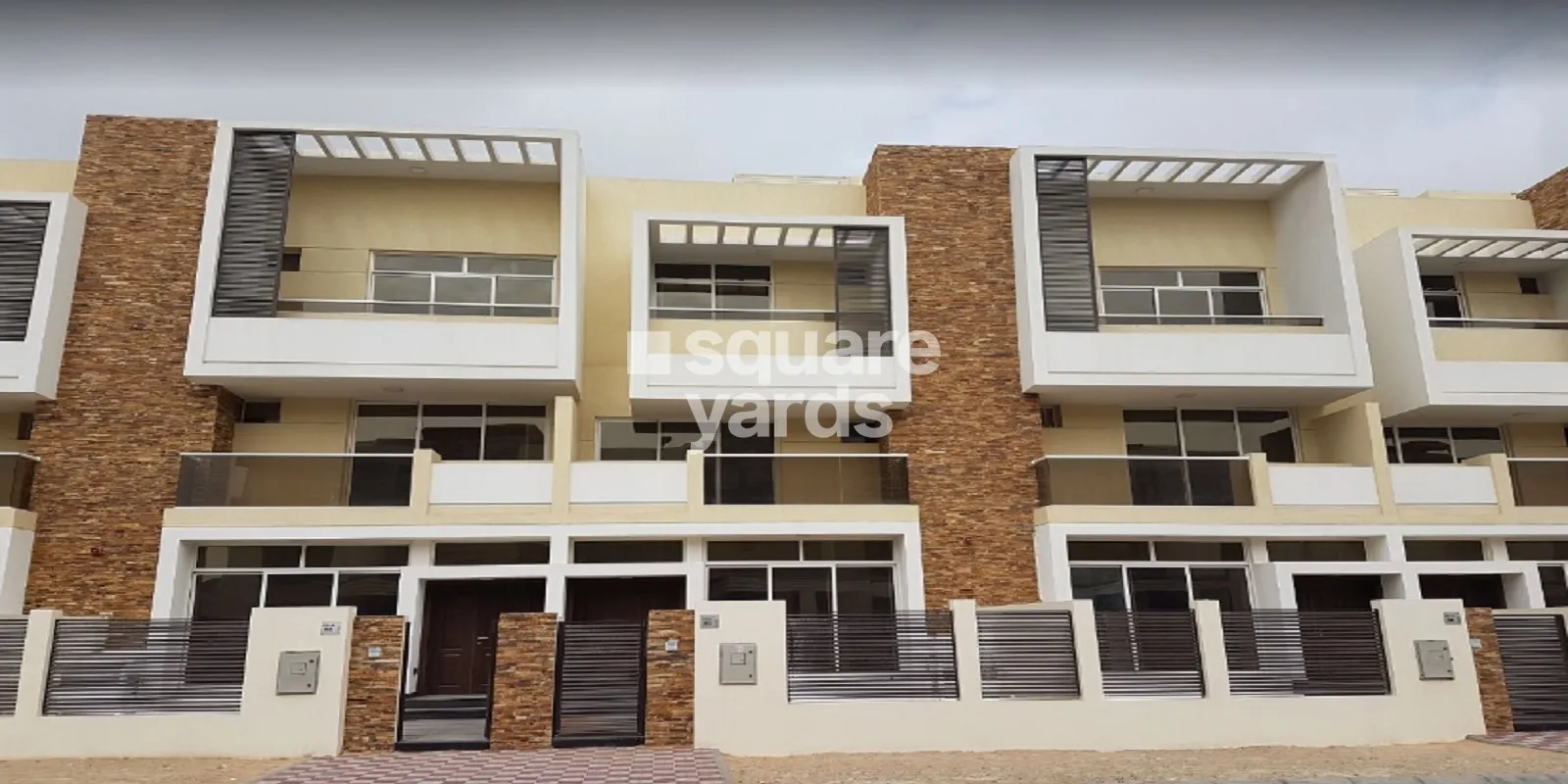 Front facade of townhouses with stone columns