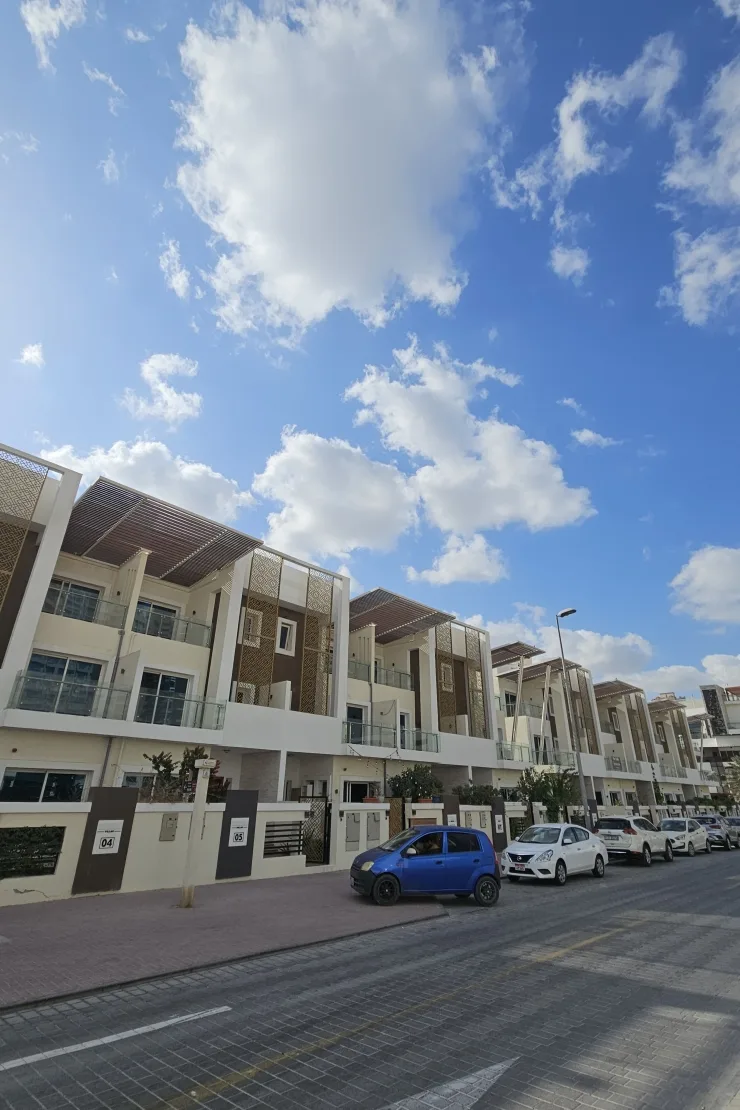 Street view of townhouse row with lattice panels