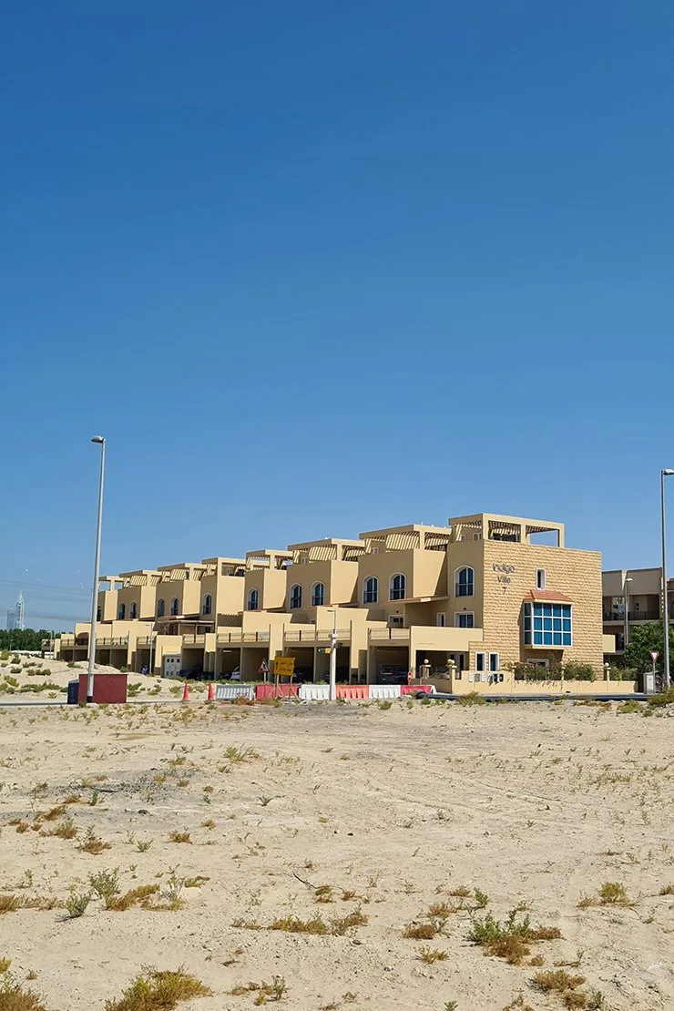 Full townhouse block with Indigo Ville sign