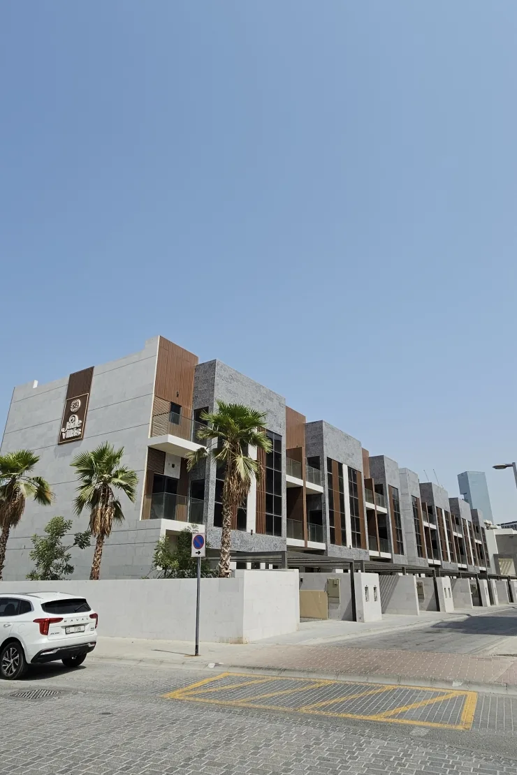 Jade Villas street facade with signage, timber and stone cladding