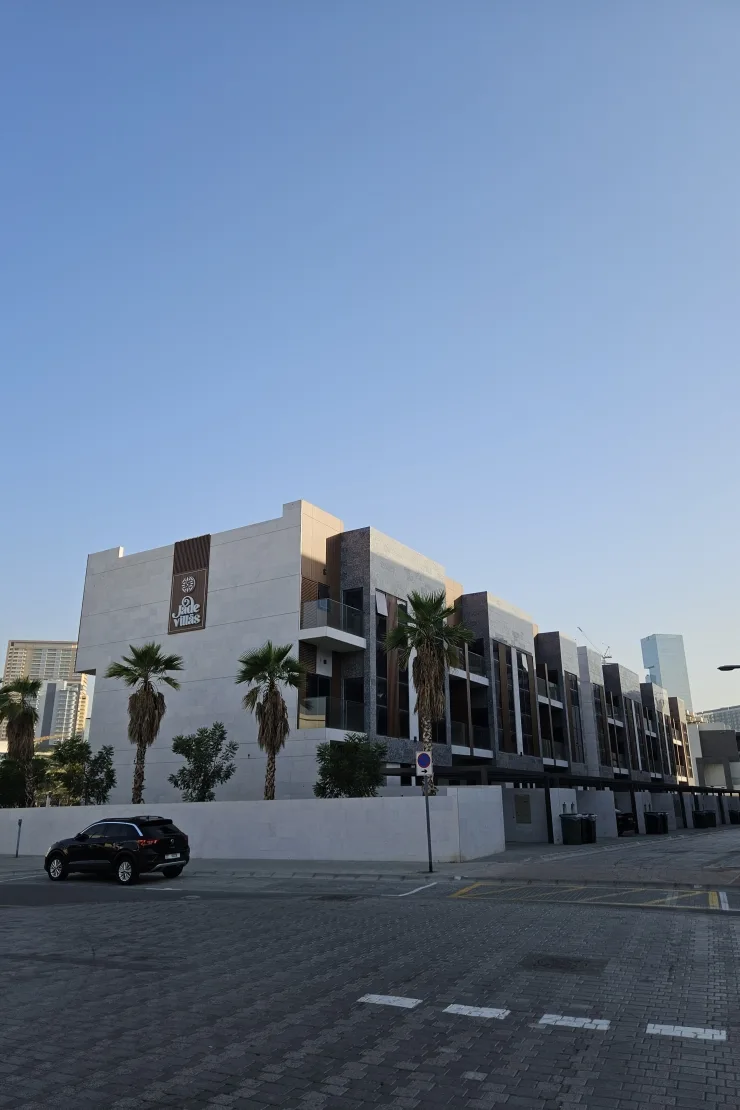 Jade Villas row from the corner, signage visible