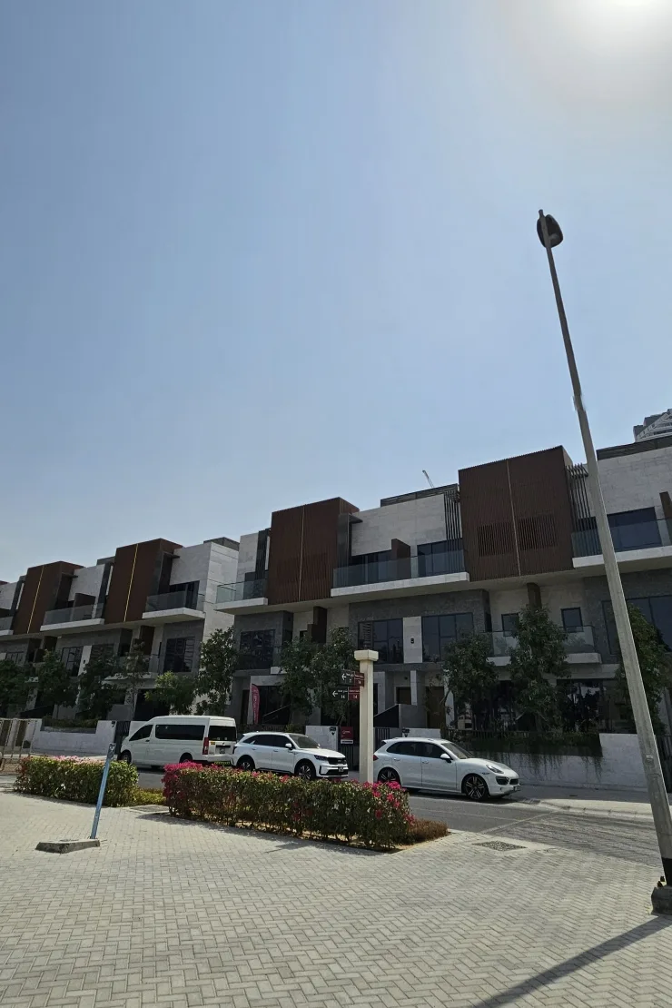 Street view of townhouse facades with timber cladding