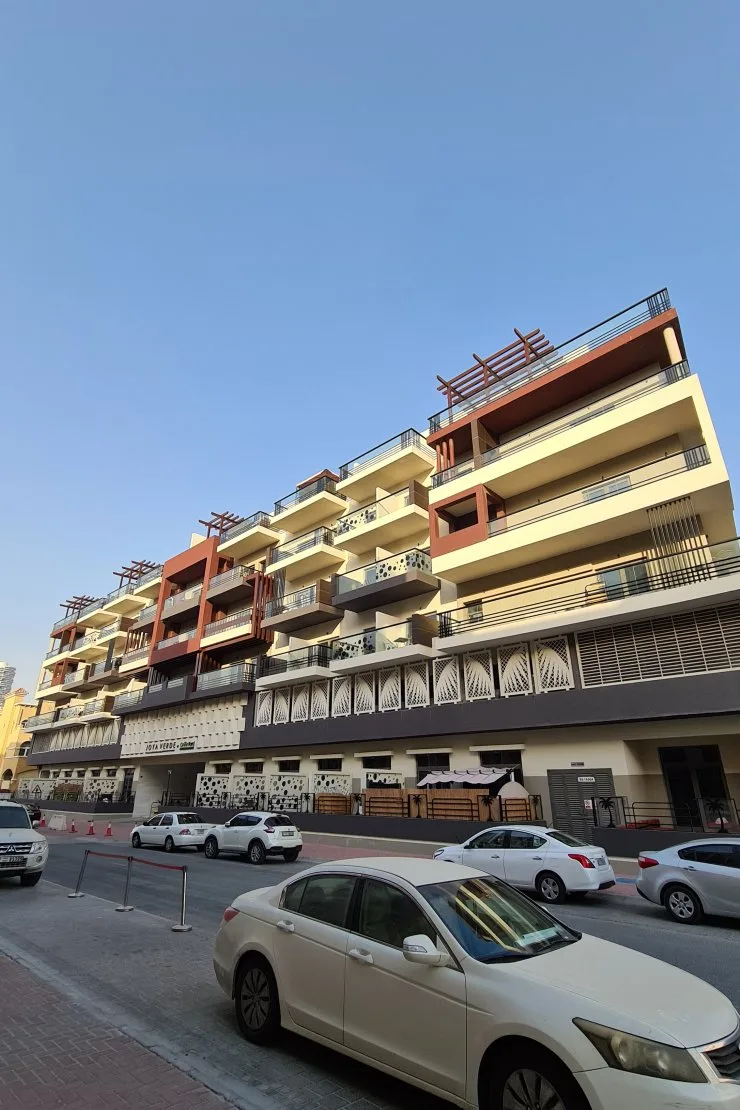 Street-side facade with balconies and pergolas