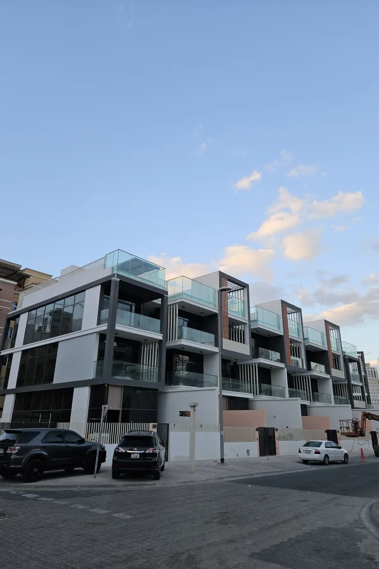 Corner view of balconies and dark glazing