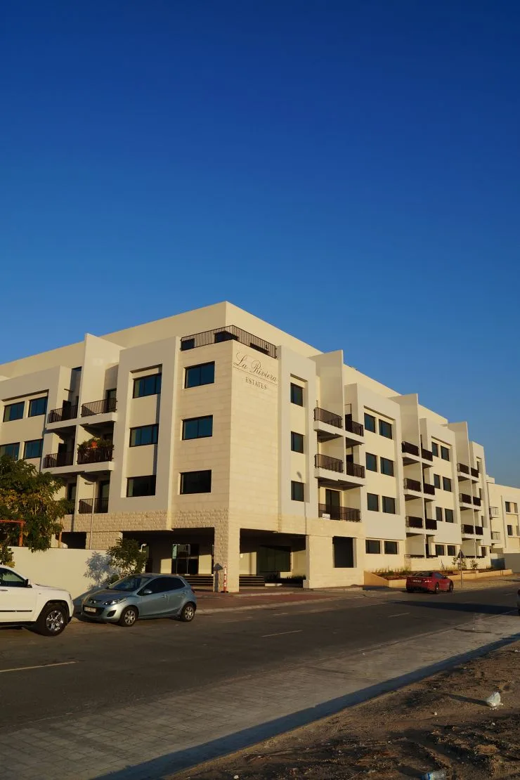 Street view of La Riviera Estates in evening light