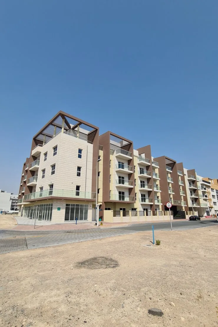 Corner block with pergola roof and balconies, street view