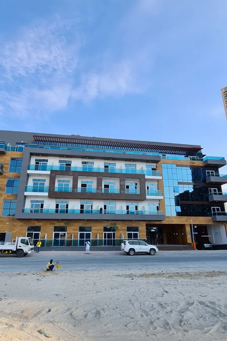 Front facade with balconies and glass corner
