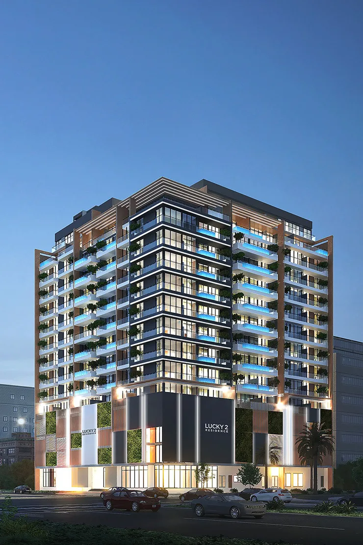 Corner view of tower with balcony pools at dusk