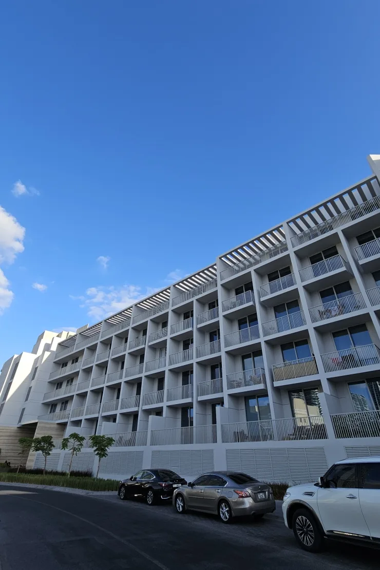 Street-side facade with balconies and roof pergolas