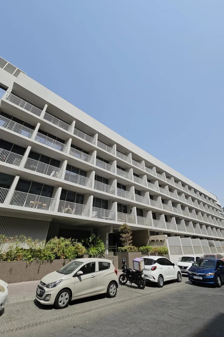 Street-side facade with balconies and entrance